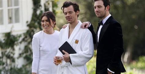 Harry Styles wears a robe to a wedding