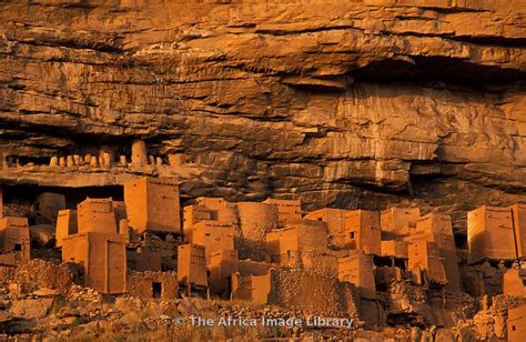 Abandoned cliff dwellings on the Bandiagara escarpment above Telí village, Dogon Country, Mali ...