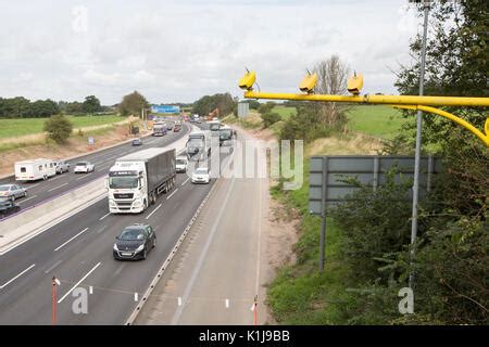 Average speed cameras on the M6 motorway in Cheshire,UK Stock Photo - Alamy