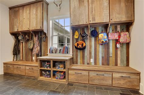 Rustic wood cubby hole storage in this garage entryway | Eclectic ...