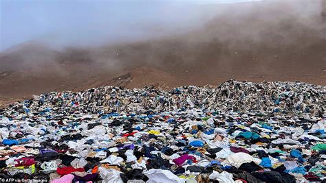The fast-fashion waste mountain: Gigantic pile of clothes including Christmas sweaters and ski ...