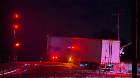 Semi-truck stopped on railroad tracks after crash | WOODTV.com