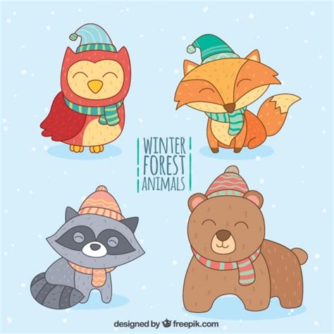 Premium Vector | Pack of happy animals with hand drawn winter elements