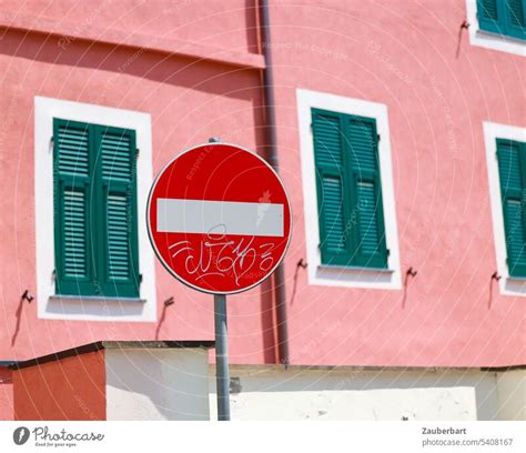 No through traffic sign in front of pink facade with green shutters - a Royalty Free Stock Photo ...