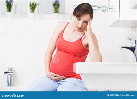 Pregnant Woman Suffering with Morning Sickness in Bathroom Stock Photo - Image of holding ...