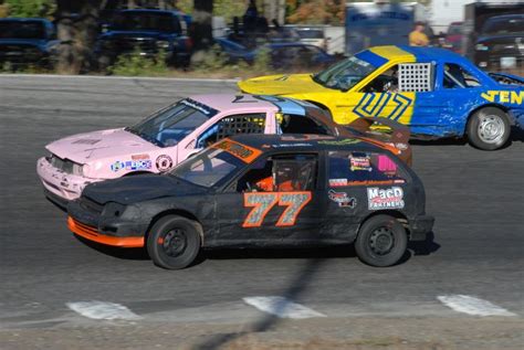 two cars are racing on the track with each other