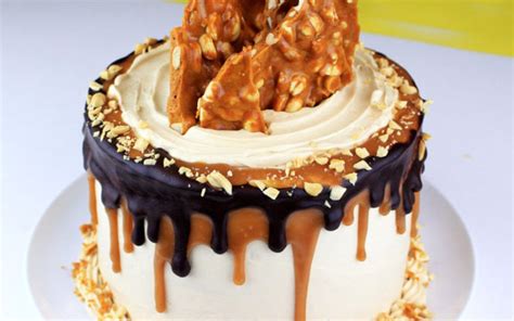 Super moist peanut butter cake layered with peanut butter fudge filling topped off with a ...