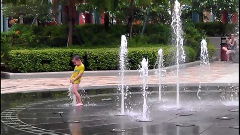 Funny kid playing in the water fountain - YouTube