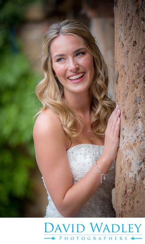 Bride outside Grafton Manor on her Wedding day. - Shustoke Barn - David Wadley Photographers