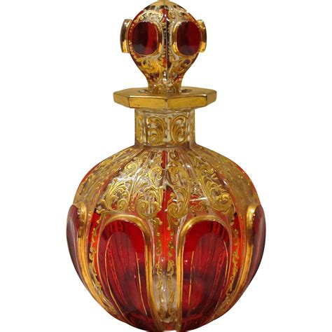 A gorgeous Moser ruby cabochon perfume or scent bottle with matching original stopper dating fro ...