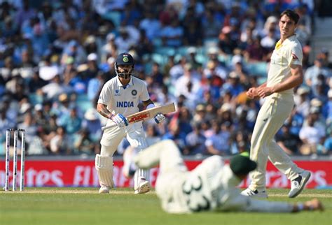 Virat Kohli and Pat Cummins see if the fielder at mid-off has stopped ...