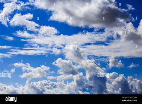 White clouds hanging from blue sky for backdrop. Scattered clouds on ...