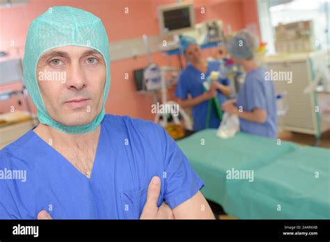 portrait of surgeon with medical reports at hospital Stock Photo - Alamy