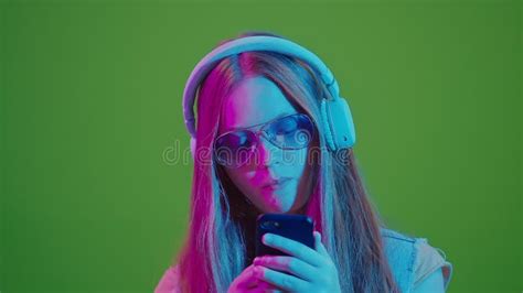 2-in-1 Split Green Screen. Teenage Girl Smiles As she Eats an Apple, Embodying Stock Footage ...