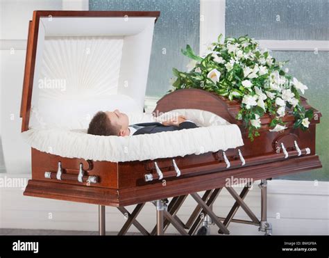 Precursor graduate School agenda dead body in coffin refugees bathing bath