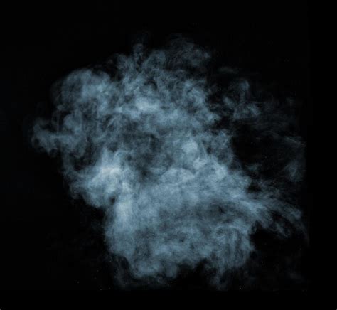 Premium Photo | Close up of steam smoke on black background