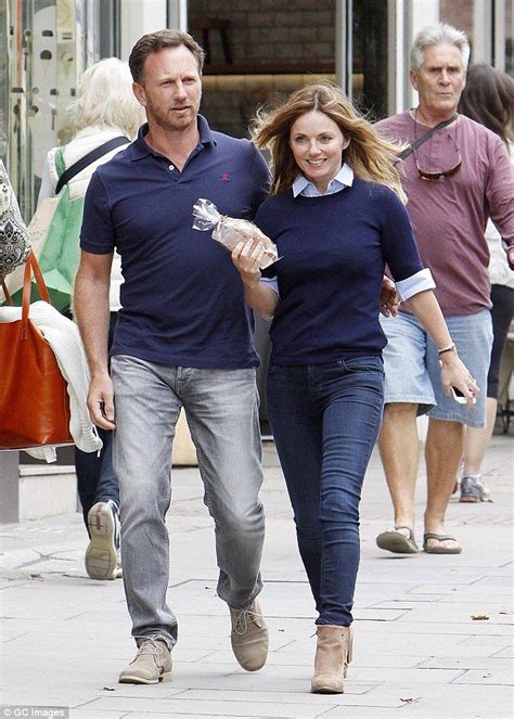 Happy couple: Geri Halliwell, 43, trod the London streets on Wednesday ...