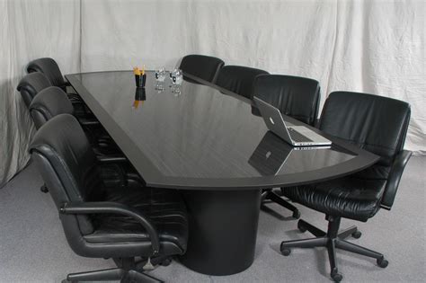 Long rectangle black glass conference table added by black leather ...