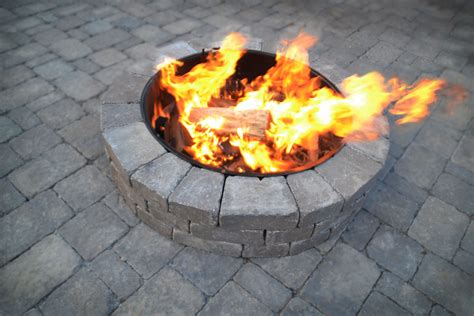 Custom fire pit on a paver patio. | Fire pit, Custom fire pit, Hardscape