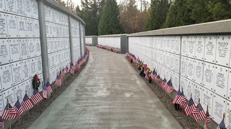 Tahoma National Veteran's Cemetery all arrayed by thousands of flags in preparation for Veteran ...