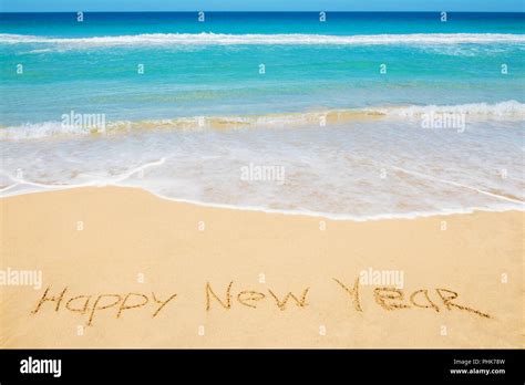 Happy New Year message on the beach Stock Photo - Alamy