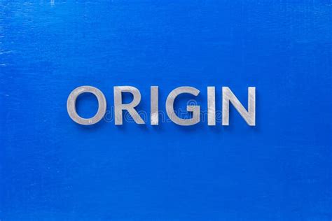 The Word Origin Laid with Silver Metal Characters on Blue Board in Flat ...