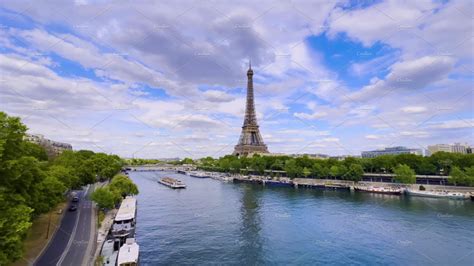 Aerial drone distant sunset view of Tour Eiffel Tower and Seine River ...