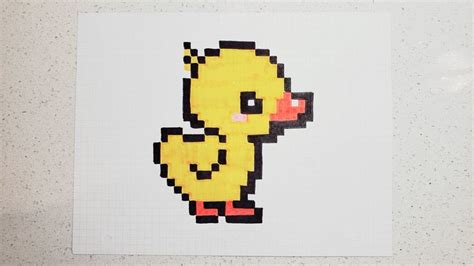 an image of a yellow duck pixelated in the shape of a computer mouse on ...