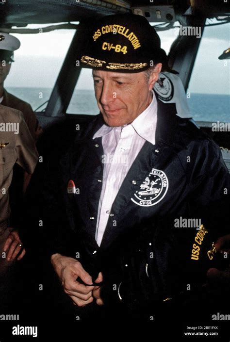 1982 - Secretary of Defense Caspar Weinberger snaps his jacket as he ...