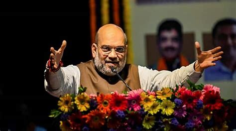 Amit Shah takes dig at Manmohan, says Modi has enhanced value of Indian ...