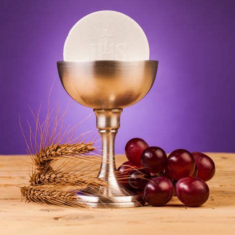 The Host and Chalice with Wheat and Grapes / © MariuszSzczygiel /Getty Images via Canva Pro # ...