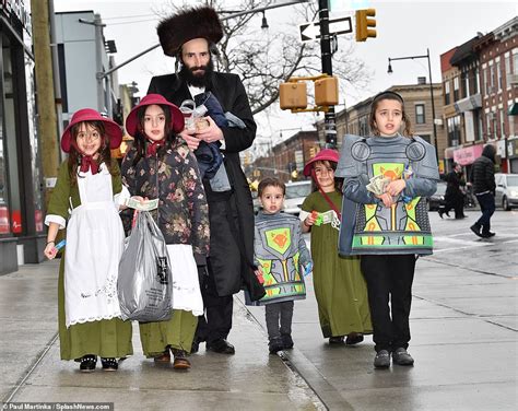 Jewish children in Brooklyn dress up in colorful costumes as they celebrate festival of Purim ...