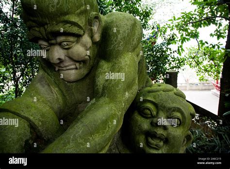 Stone demon statues carvings in Ghost City of Fengdu China Stock Photo ...