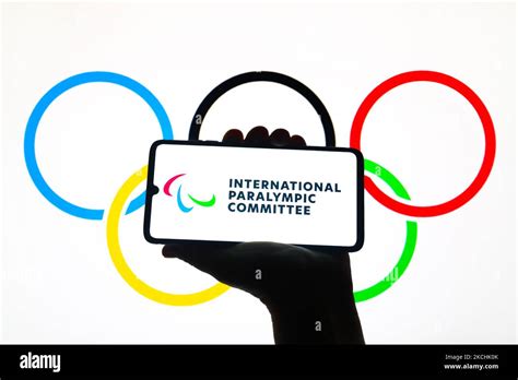 International Paralympic Committee logo is displayed on a mobile phone screen photographed with ...