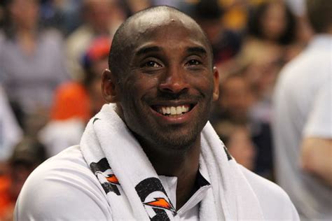 Kobe_Bryant_smiling_on_the_bench_USA_vs_GBR_2012 | Alexandra Walt | Flickr