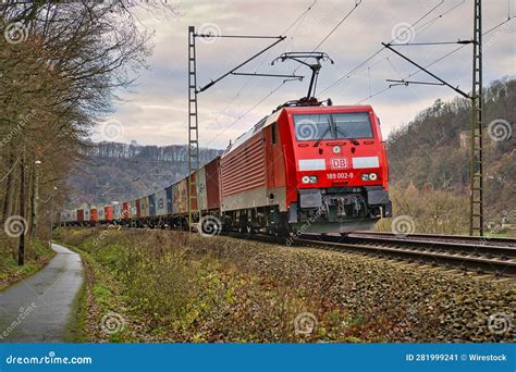 Vintage Red Train Moves Along the Tracks in a Landscape, with Lush ...