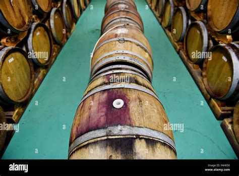 Industry detail with several wooden wine barrels in a wine cellar Stock ...