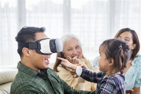 Happy Man Wears a VR Headset with His Family Stock Image - Image of ...