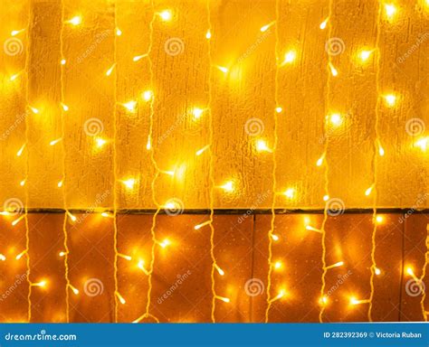 Christmas Yellow Light Garlands Hang Vertically on the Wall Stock Image - Image of glow, light ...
