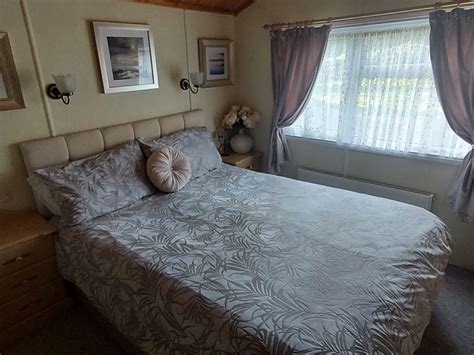 Luxury pine lodge for rent on Killigarth Manor Holiday Park