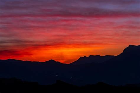 Premium Photo | Sunset in the mountains evening landscape with bright sky