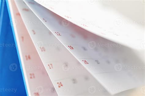 Calendar page flipping sheet close up on office table background business schedule planning ...