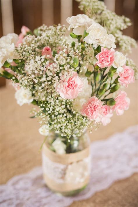 Pink Carnation and Baby's Breath Centerpieces. Love it!! Would add some light blue ones too ...