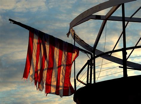 Flag On The Bow Of A Ship. Photograph by Luis Baez - Fine Art America