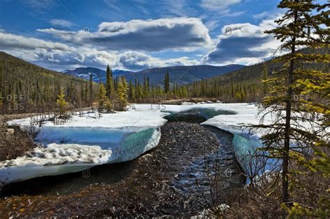 Monument Creek meanders through melting snow in early spring, Chena ...