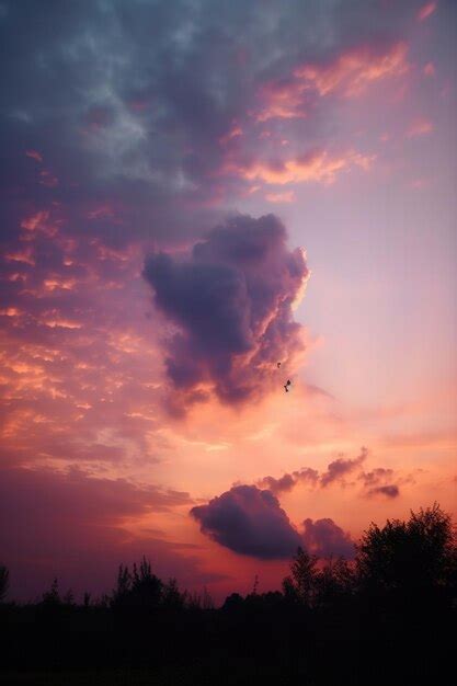 Premium Photo | Beautiful clouds at sunset at skyscraper purple sunset and silhouetted clouds