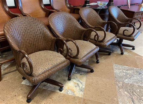 Set of 4 swivel dinette chairs on wheels. These comfortable rattan and cane chairs are easy to ...