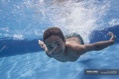 Boy swimming underwater — youth, 1 Person - Stock Photo | #124198056