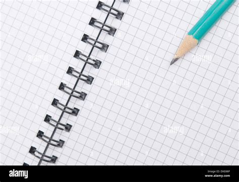 green pencil on a spiral notebook Stock Photo - Alamy