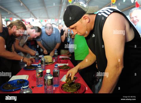 USA Hatch New Mexico- Chile Festival- chile eating contest- eating hot big Jim peppers Stock ...